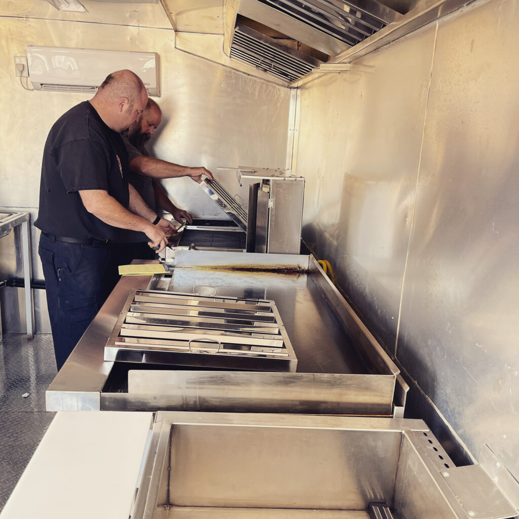 A P Fire Protection conducts a walkthrough on a food truck.